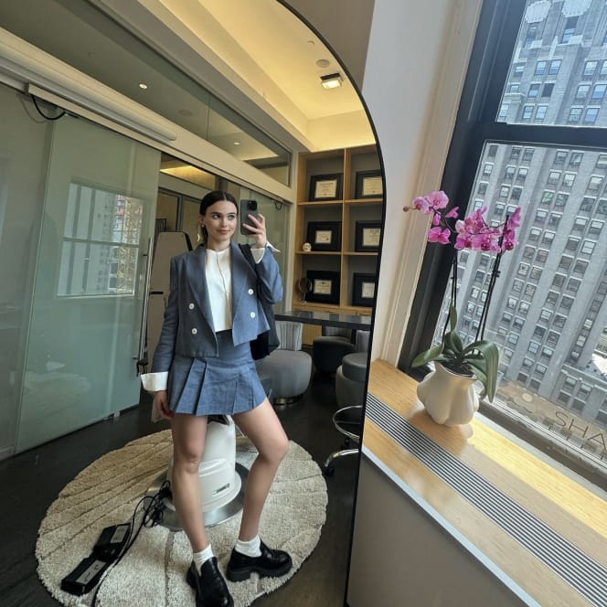 woman taking a selfie in a mirror