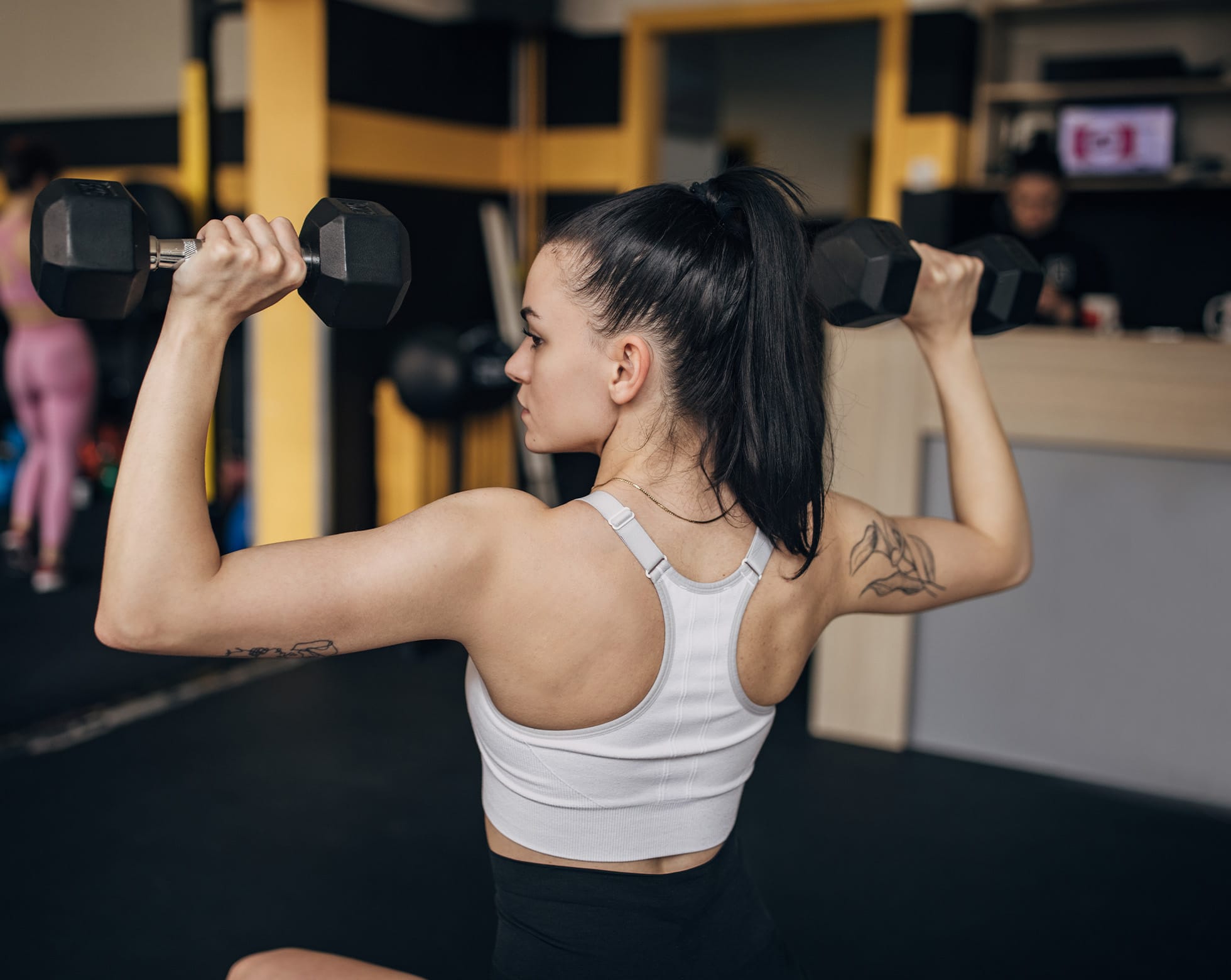 Woman lifting dumbells