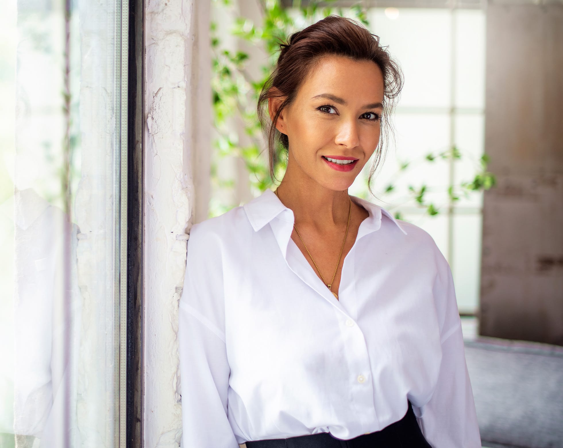 woman in a white button up shirt