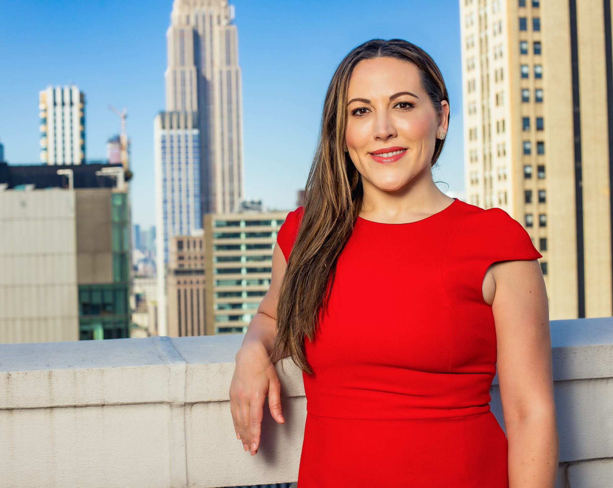 woman in red dress smiling