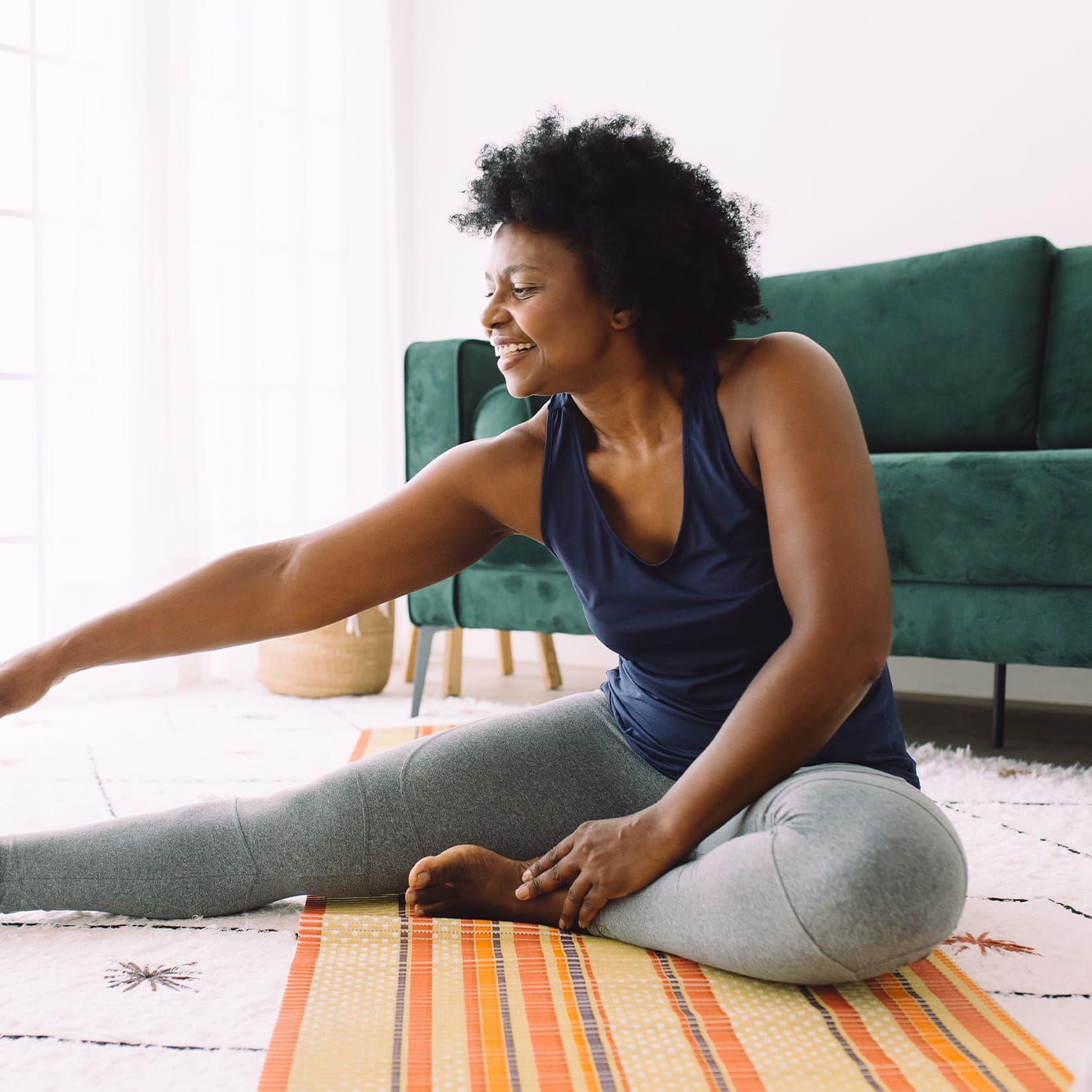 Woman stretching on the floor