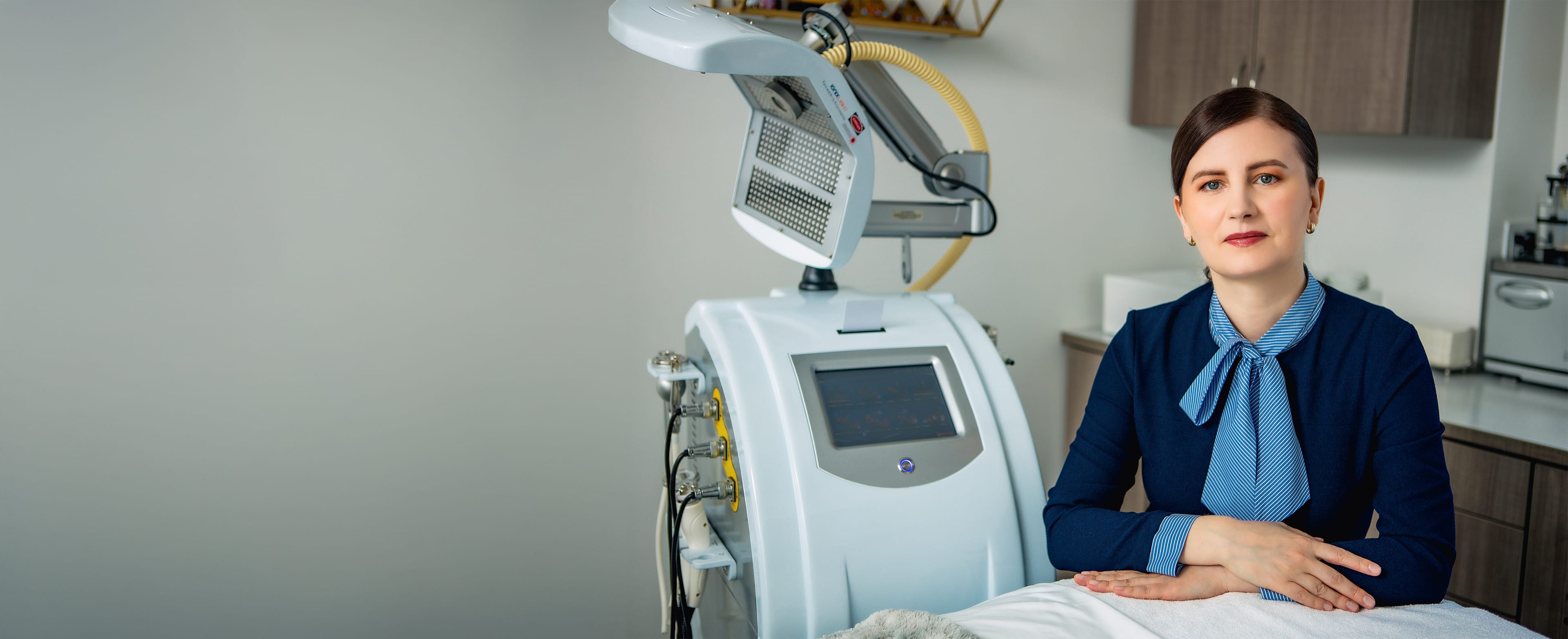 Woman sitting near medical equipment